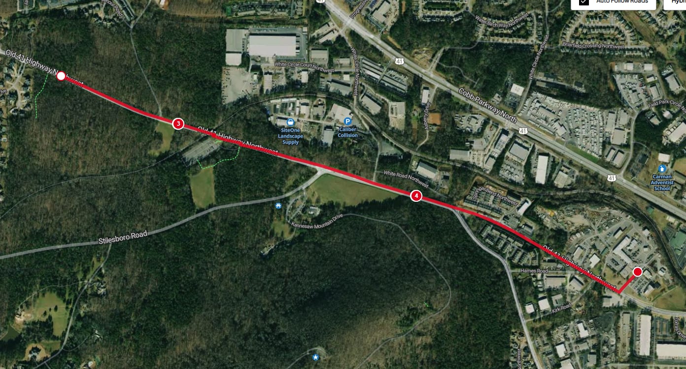 Aerial map of the Old 41 Run course: a red route running down Old 41 Highway Northwest past Kennesaw Mountain in Marietta, with start and finish marked near the C.W. Matthews office.